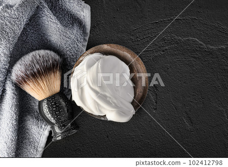 Shaving brush and shaving foam on black concrete background Shaving brush and shaving foam on black concrete background 102412798