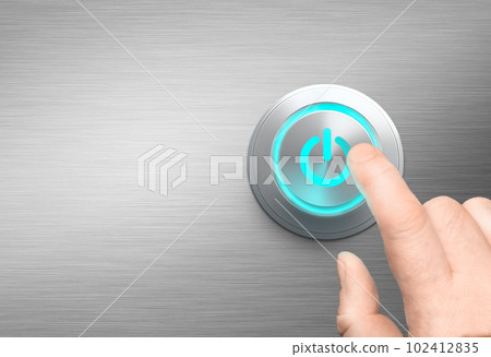 Finger about to press a power button polished metal background Finger about to press a power button polished metal background 102412835
