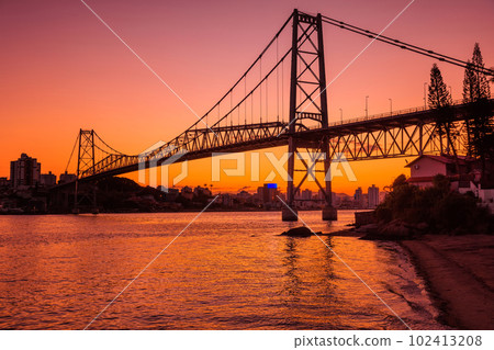 Hercilio luz bridge with warm sunset in Florianopolis Hercilio luz bridge with warm sunset in Florianopolis 102413208