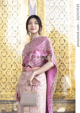 Beautiful Asian girl in Thai traditional costume at temple Beautiful Asian girl in Thai traditional costume at temple 102414585