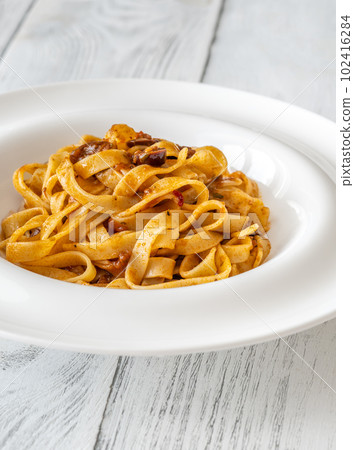 Portion of pasta puttanesca 102416284