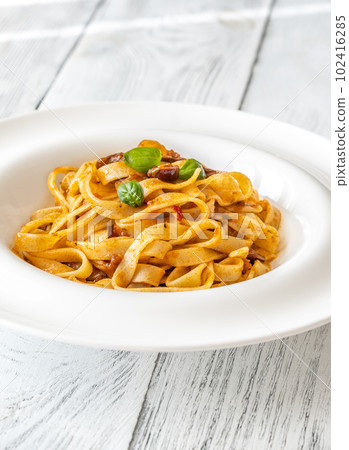 Portion of pasta puttanesca 102416285