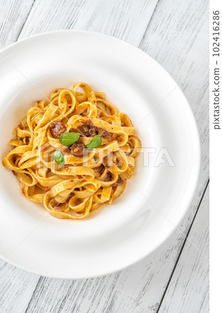 Portion of pasta puttanesca 102416286