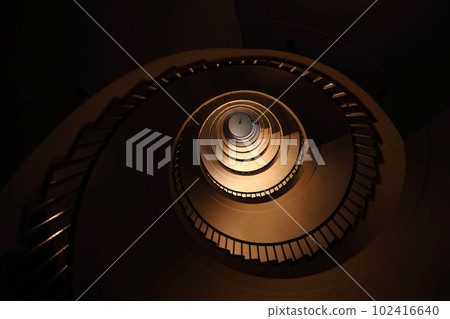 Spiral staircase in a tall multi-floor house, in the form of a "golden ratio", architecture, concept 102416640