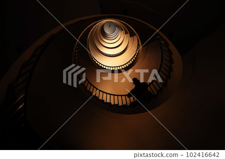 Spiral staircase in a tall multi-floor house, in the form of a "golden ratio", architecture, concept Spiral staircase in a tall multi-floor house, in the form of a "golden ratio", architecture, concept 102416642