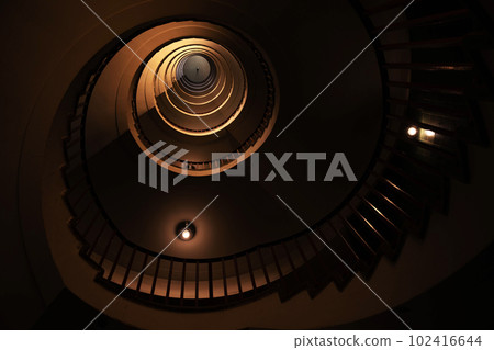 Spiral staircase in a tall multi-floor house, in the form of a "golden ratio", architecture, concept Spiral staircase in a tall multi-floor house, in the form of a "golden ratio", architecture, concept 102416644
