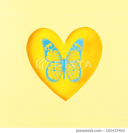 A Butterfly made from carve paper or cutting in heart shape paper on yellow background. 102417403