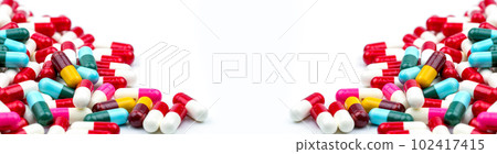 Frame of colorful antibiotic capsule pills. Pile of antibiotic capsule pills. Antibiotic drug resistance concept. Prescription drug. Pharmaceutical industry. Healthcare and medicine. Medical care. Frame of colorful antibiotic capsule pills. Pile of antibiotic capsule pills. Antibiotic drug resistance concept. Prescription drug. Pharmaceutical industry. Healthcare and medicine. Medical care. 102417415