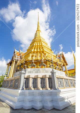 golden pagoda in the temple also known as the Temple of the Emerald Buddha in Bangkok, Thailand . 102417472