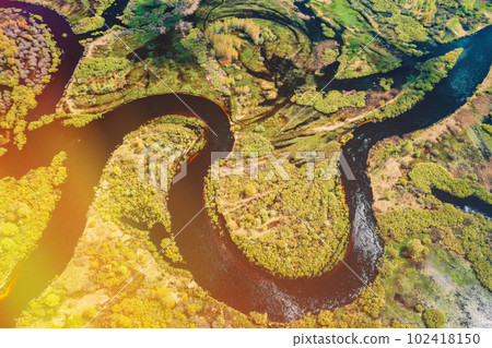 Aerial View Green Forest Woods And River Landscape In Sunny Spring Summer Day. Top View Of Nature, Bird's Eye View. Trees Standing In Water During Spring Flood floodwaters. woods in Water deluge 102418150