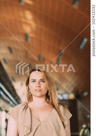 Portrait of young caucasian woman lady tourist traveler standing on the Dubai metro train station. High quality photo 102418192