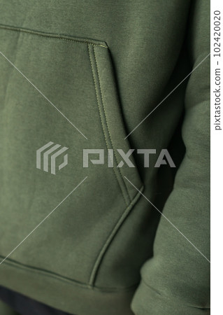 Close up of detail sweatshirt or hoodie - fabric and tailoring clothes design concept Close up of detail sweatshirt or hoodie - fabric and tailoring clothes design concept 102420020