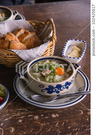 Vegetable soup and bread butter mountain meal 102420817