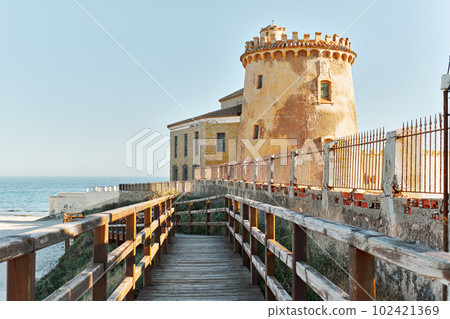 Wooden boardwalk lead to the Torre de la Horadada Wooden boardwalk lead to the Torre de la Horadada 102421369