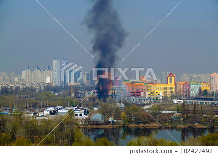 Kiev, Ukraine March 29, 2020: Fire in one of the buildings of the city of Kiev view from the top Kiev, Ukraine March 29, 2020: Fire in one of the buildings of the city of Kiev view from the top 102422492