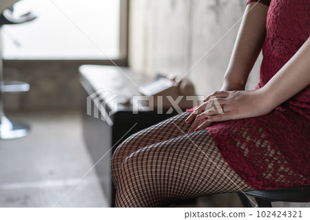 A woman wearing a ring Night work A woman wearing a ring Night work 102424321