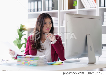 Accountant asian woman working on laptop and do document, tax, exchange, accounting and Financial advisor concept Accountant asian woman working on laptop and do document, tax, exchange, accounting and Financial advisor concept 102427733
