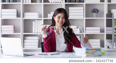 Accountant asian woman working on laptop and do document, tax, exchange, accounting and Financial advisor concept Accountant asian woman working on laptop and do document, tax, exchange, accounting and Financial advisor concept 102427736