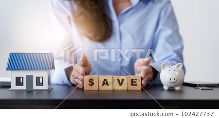 Concept of retirement, save money and cash, finance, investing, growth management, income, tax, financial planning. Real Estate agent working at office. Concept of retirement, save money and cash, finance, investing, growth management, income, tax, financial planning. Real Estate agent working at office. 102427737