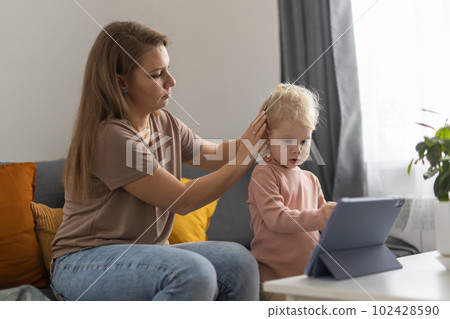Funny baby with cochlear implant. Hear aid and medicine innovating technology and diversity concept Funny baby with cochlear implant. Hear aid and medicine innovating technology and diversity concept 102428590