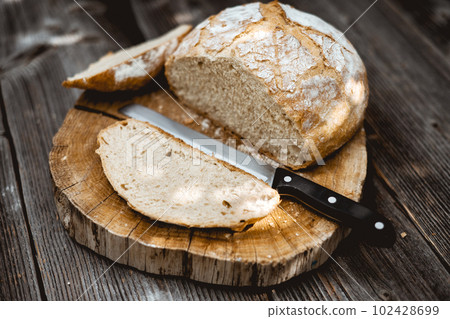 Traditional sourdough bread, sliced and ready to eat Traditional sourdough bread, sliced and ready to eat 102428699