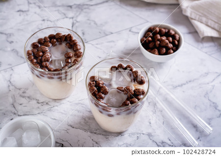 Homemade milk bubble tea with ice in glasses on the table Homemade milk bubble tea with ice in glasses on the table 102428724