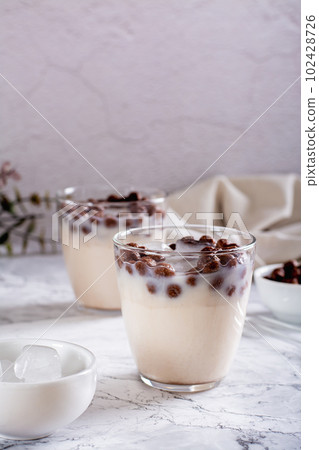 Bubble milk tea with ice in glasses on the table vertical view 102428726