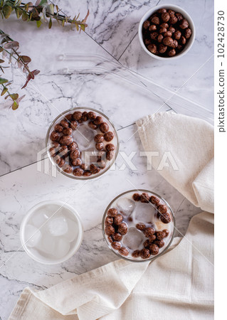 Homemade milk bubble tea with ice in glasses on the table top and  vertical view 102428730