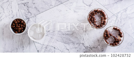 Homemade milk bubble tea with ice in glasses on the table top view web banner 102428732