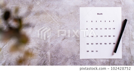 Calendar sheet for planning and pen on desktop top view web banner Calendar sheet for planning and pen on desktop top view web banner 102428752