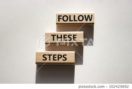 Follow these steps symbol. Wooden blocks with words Follow these steps. Beautiful white background. Business and Follow these steps concept. Copy space. Follow these steps symbol. Wooden blocks with words Follow these steps. Beautiful white background. Business and Follow these steps concept. Copy space. 102429892