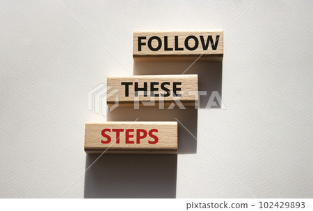 Follow these steps symbol. Wooden blocks with words Follow these steps. Beautiful white background. Business and Follow these steps concept. Copy space. Follow these steps symbol. Wooden blocks with words Follow these steps. Beautiful white background. Business and Follow these steps concept. Copy space. 102429893