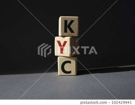 KYC - Know Your Customer. Wooden cubes with word KYC. Beautiful grey background. Business and Know Your Customer concept. Copy space. 102429941