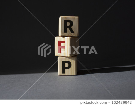 RFP - Request for Proposal. Wooden cubes with word RFP. Beautiful grey background. Business and Request for Proposal concept. Copy space. RFP - Request for Proposal. Wooden cubes with word RFP. Beautiful grey background. Business and Request for Proposal concept. Copy space. 102429942