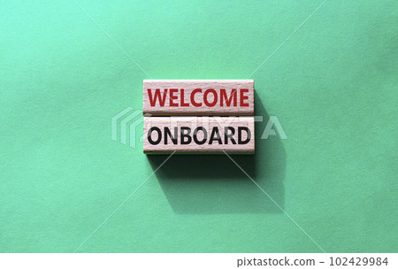 Welcome onboard symbol. Concept words Welcome onboard on wooden blocks. Beautiful green background. Business and Welcome onboard concept. Copy space. 102429984