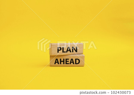 Plan ahead symbol. Wooden blocks with words Plan ahead. Beautiful yellow background. Business and Plan ahead concept. Copy space. Plan ahead symbol. Wooden blocks with words Plan ahead. Beautiful yellow background. Business and Plan ahead concept. Copy space. 102430073