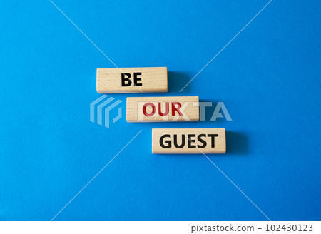 Be our guest symbol. Concept word Be our guest on wooden blocks. Beautiful blue background. Business and Be our guest concept. Copy space Be our guest symbol. Concept word Be our guest on wooden blocks. Beautiful blue background. Business and Be our guest concept. Copy space 102430123