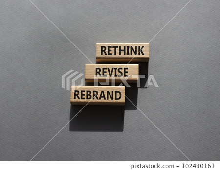 Rethink Revise Rebrand symbol. Wooden blocks with words Rethink Revise Rebrand. Beautiful grey background. Business and Rethink Revise Rebrand concept. Copy space. 102430161