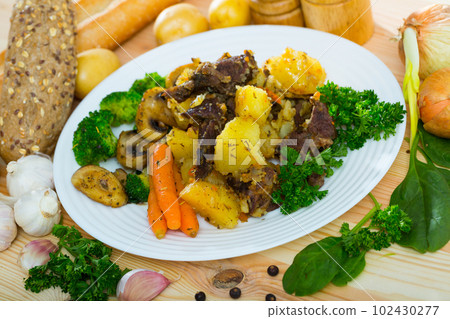 Beef stewed with potatoes, champignons, carrots, broccoli Beef stewed with potatoes, champignons, carrots, broccoli 102430277