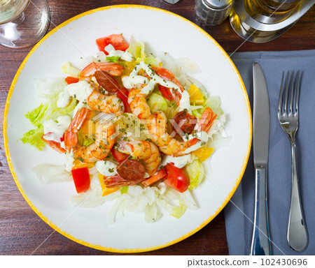Salad with roasted shrimps and chorizo Salad with roasted shrimps and chorizo 102430696