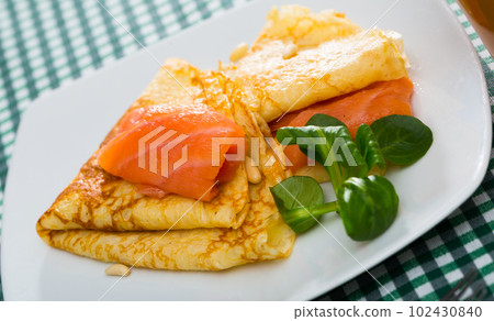 Delicious pancakes with salted salmon 102430840
