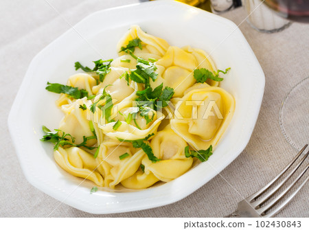 Ravioli with parsley 102430843