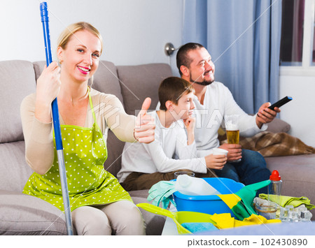 Smiling woman dressed for cleaning 102430890