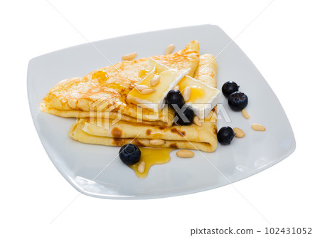 Crepes with brie and honey Crepes with brie and honey 102431052