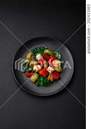 Delicious fresh salad of zucchini, cheese, sweet peppers, spinach with spices and herbs Delicious fresh salad of zucchini, cheese, sweet peppers, spinach with spices and herbs 102431063