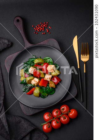 Delicious fresh salad of zucchini, cheese, sweet peppers, spinach with spices and herbs Delicious fresh salad of zucchini, cheese, sweet peppers, spinach with spices and herbs 102431090