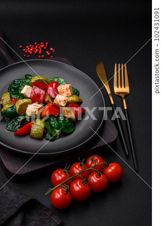 Delicious fresh salad of zucchini, cheese, sweet peppers, spinach with spices and herbs Delicious fresh salad of zucchini, cheese, sweet peppers, spinach with spices and herbs 102431091