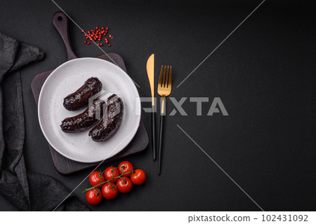 Delicious black blood sausage or black pudding with spices and herbs 102431092