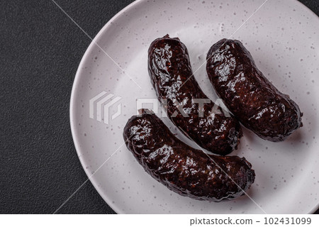 Delicious black blood sausage or black pudding with spices and herbs Delicious black blood sausage or black pudding with spices and herbs 102431099