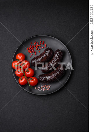 Delicious black blood sausage or black pudding with spices and herbs Delicious black blood sausage or black pudding with spices and herbs 102431123